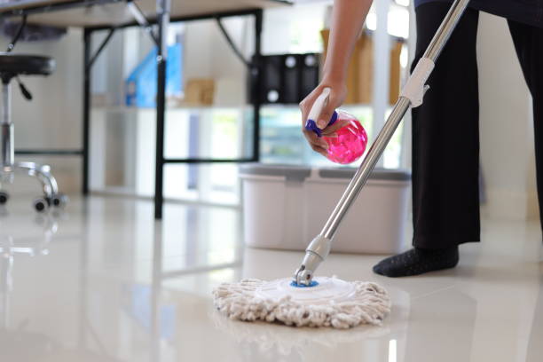 istock Cleaner is mopping floors at home with a mop. 1877220191
