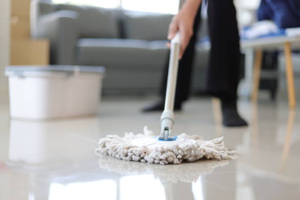 istock Cleaner is mopping floors at home with a mop. 1877220508