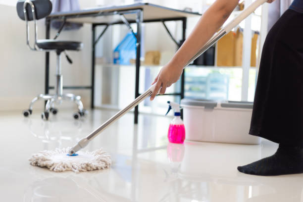 istock Cleaner is mopping floors at home with a mop. 1877220509