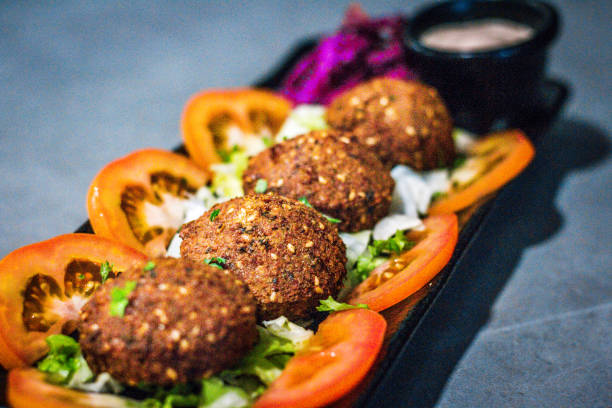 istock a serving of Hot Mezza - Falafel served with  tomatoes, lettuce and red cabbage 1877248255