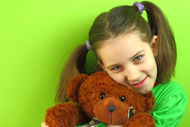 istock Girl with teddy bear 187728999