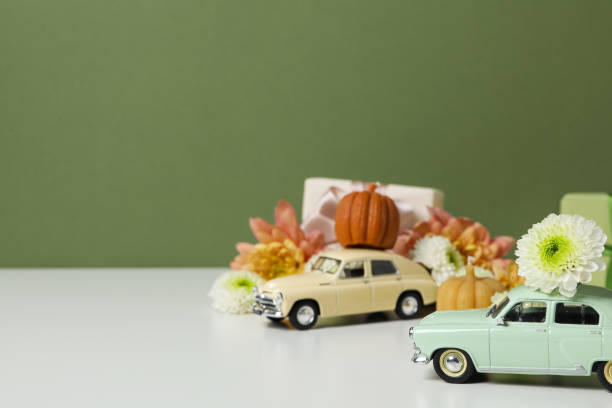 Autumn or fall travel and vacation concept with car