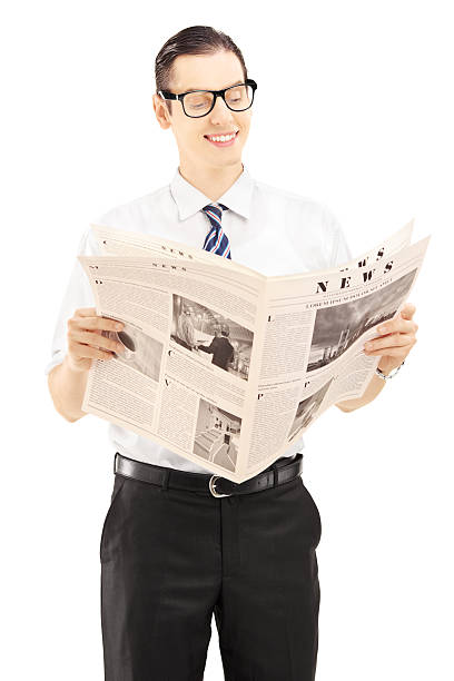 istock Young businessperson reading a newspaper 187730298
