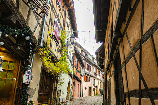 Image of a narrow street in the beautiful village of Eguisheim in December 2022