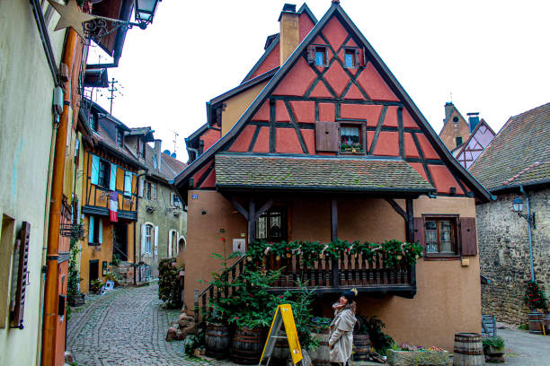 Image of a woman enjoying the village of Eguisheim during Christmas. Image taken in December 2022