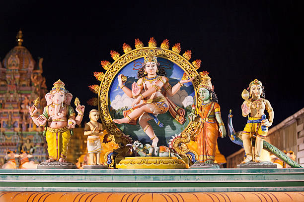 Shiva, Parvati, Ganesha and Karthikeya The sculpture at the entrance of the "Shri Maha Kali" temple represents Shiva and his wife Parvati and their children Ganesha and Karthikeya. tamil temple stock pictures, royalty-free photos & images