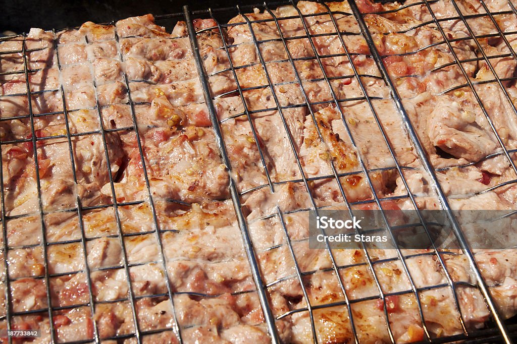 Cocinar carne - Foto de stock de A la Parrilla libre de derechos