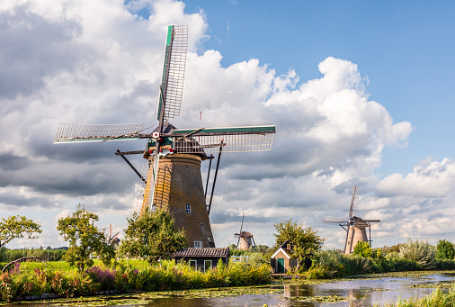 General view of the Nederwaard windmill No. 6, one of the Kinderdijk mills near Rotterdam, Netherlands, built in 1738 to drain the Alblasserwaard polder, under a stormy sky.