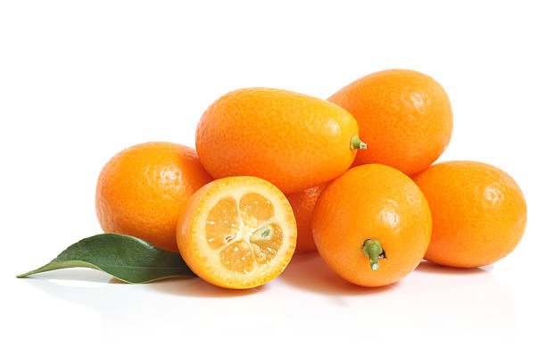 Kumquat with leaf Kumquat with leaf on a white background cydonia stock pictures, royalty-free photos & images