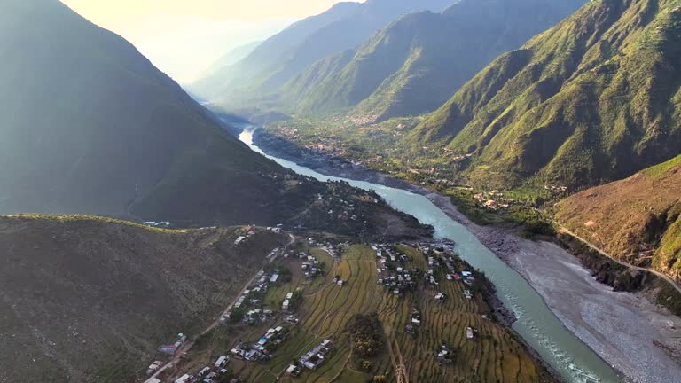 Aerial Drone Sunrise view of Besham city and Rice Field Valley with Indus River in the Shangla District of Khyber Pakhtunkhwa, Pakistan. Located on the right bank of the Indus River in Route of Karakoram Highway