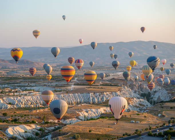 istock Hot air balloons over rocks 1877373081