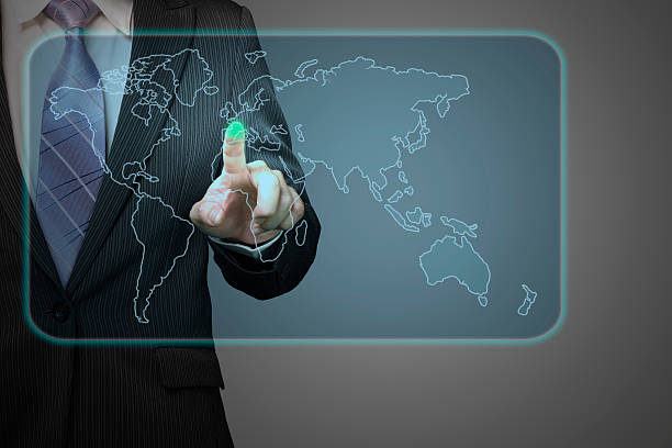 istock Businessman pushing future touch screen icon with world wide map 187737347