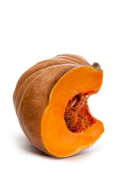 istock Part of a cut ripe pumpkin on a white background 1877379306