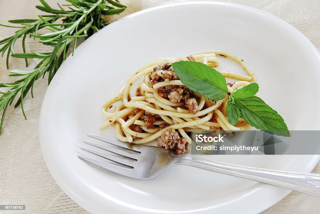Spaghetti with minced meat small portion of spaghetti mixed with minced meat served on white plate Serving Size Stock Photo
