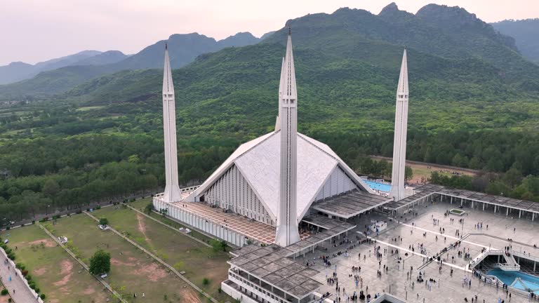 Aerial Drone Sunset Scene of Shah Faisal Mosque is one of the largest Mosques in the World which is situated in Islamabad, Pakistan.