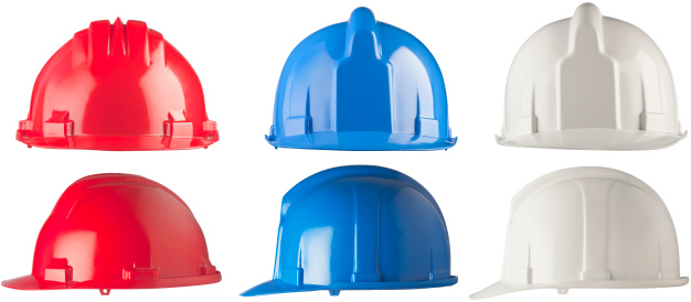 Front and side view of three hardhats, blue white and red. Made with professional studio equipment.
