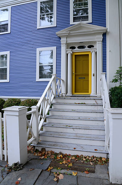 istock blue house with yellow door 187742312