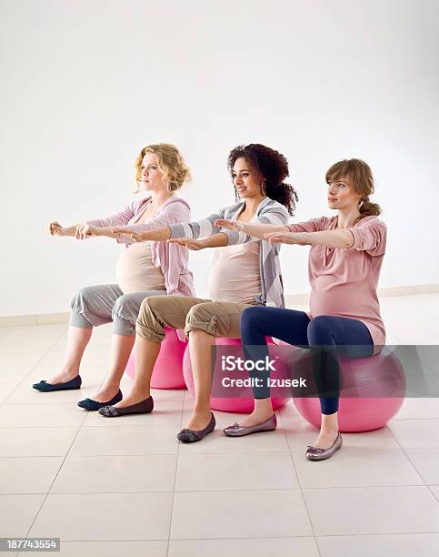 Pregnant Women Doing Exercises Stock Photo - Download Image Now - 20-24 Years, Abdomen, Adult