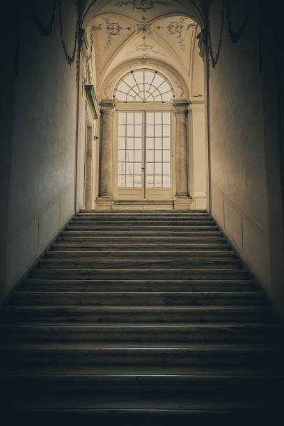 istock Ancient dark staircase - Grunge interior, nobody, empty building architecture, window. 1877442393