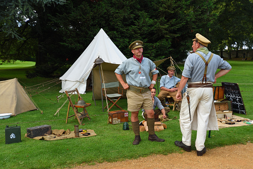 Silsoe, Bedfordshire, England - August 19, 2023: Four men in first world war uniforms in front of tents.