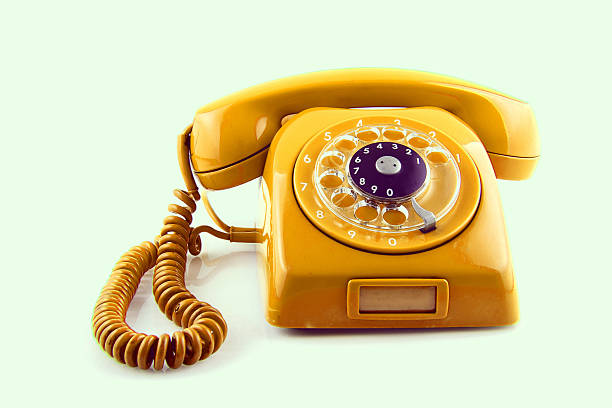 istock old Orange telephone with rotary dial 187747284