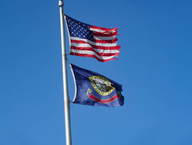 istock US flag and state Idaho flag on the pole 1877495574