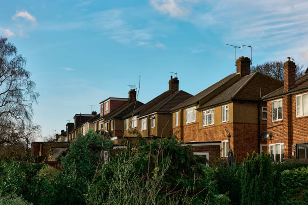 istock View showing the fronts of several town houses 1877497123
