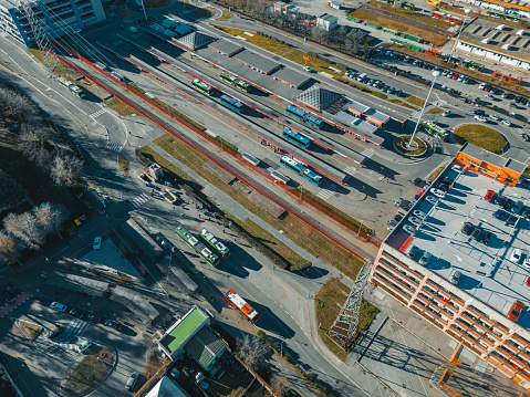 Top view from a drone of the final station of the San Donato M3 metro and Bus station. Italy, San Donato Milanese. ATM - Azienda Trasporti Milanes.