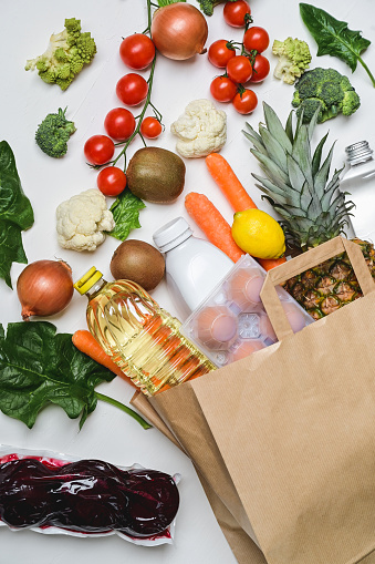 Groceries, fresh fruits and vegetables on a table.