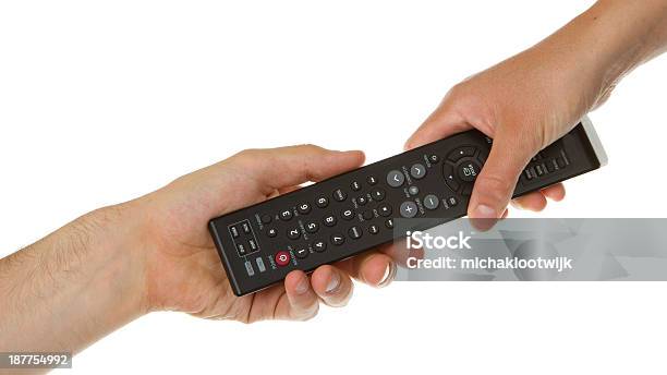 Man Giving Woman A Black Remote Stock Photo - Download Image Now - Television Set, Black Color, Remote Control
