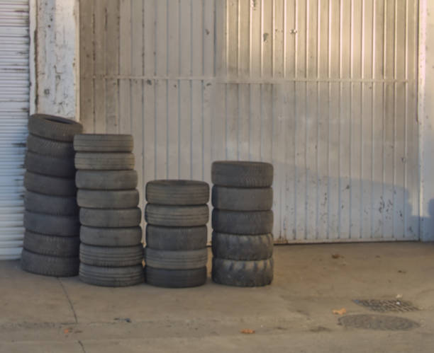 istock used car wheels stacked for recycling 1877560091