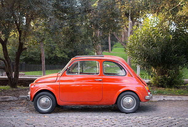 istock Tiny red vintage car in Rome, Italy 187756049