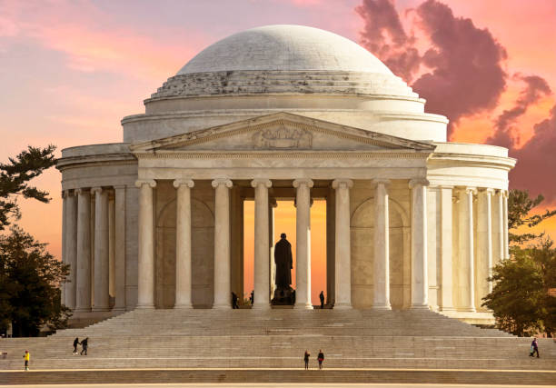 Washington, D.C., USA - August 23, 2024: Tourists visit the Thomas Jefferson Memorial on the Tidal Basin on a summer evening.