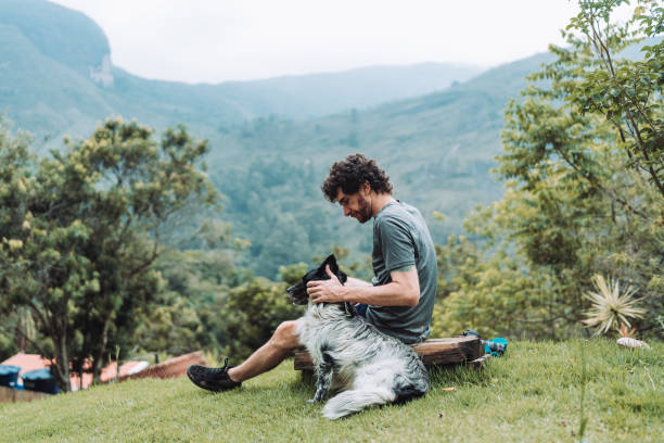 istock Man and dog enjoying the outdoors 1877580310