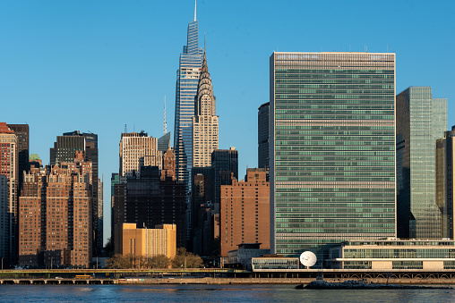 Famous structures in Midtown East in Manhattan include, from left, Tudor City, Chanin Building, Daily News Building, One Vanderbilt, Chrysler Building, United Nations Secretariat Building, and One UN Plaza. 

At the bottom of the image is the East River.