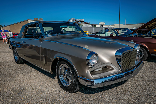 Gulfport, MS - October 01, 2023: High perspective front corner view of a 1962 Studebaker Gran Turismo Hawk Hardtop Coupe at a local car show.