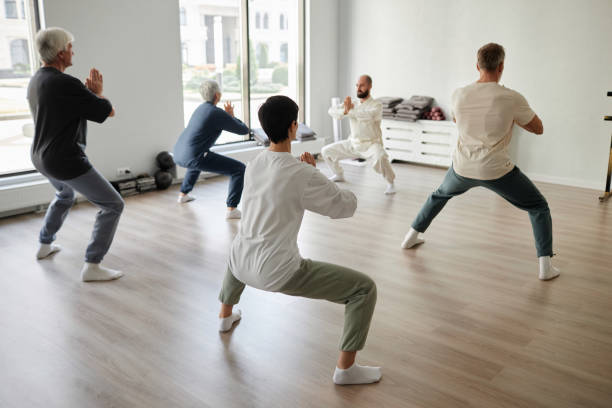 istock Group of Senior People Exercising during Yoga Class 1877662505