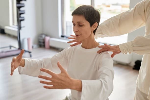 istock Focused Senior Lady Doing Yoga Breathing Exercise 1877662509