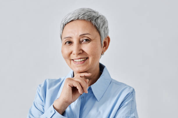 istock Confident Senior Woman Smiling at Camera 1877663058