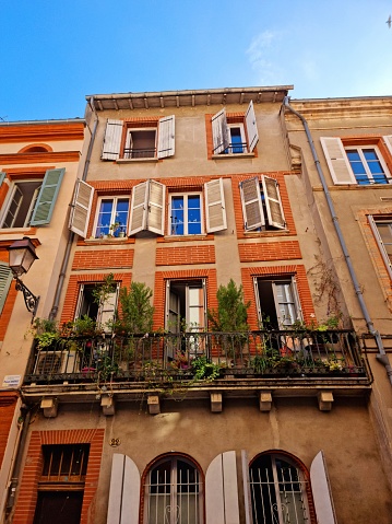An old typical residential building in Toulouse historic center. The image was captured during autumn season.