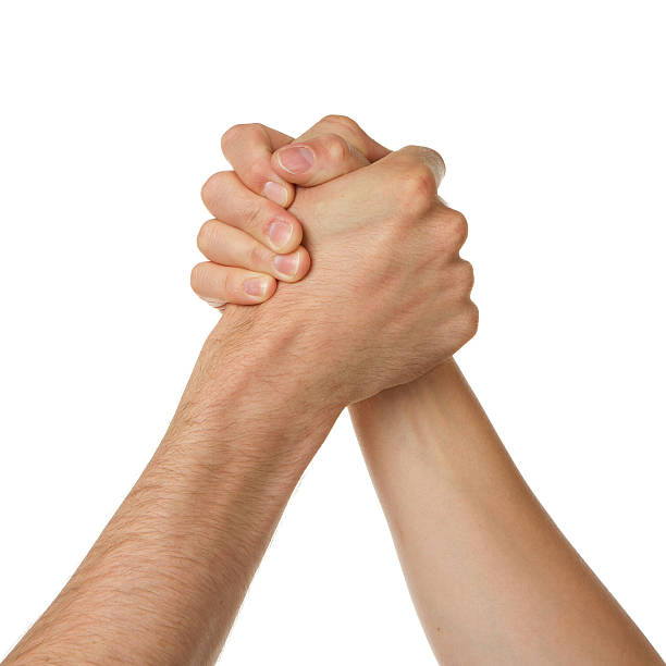 istock Man and woman in arm wrestlin 187773630