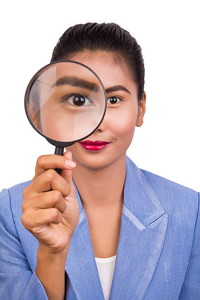 istock Business woman with a magnifier. 187773799