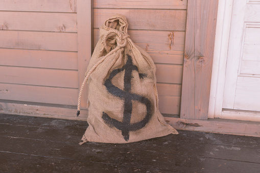 Old money bag with dollar sign on it