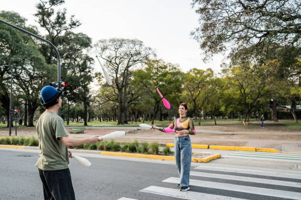 istock Jugglers performing in city traffic 1877780974