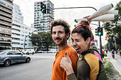 Portrait of a juggler couple in city traffic