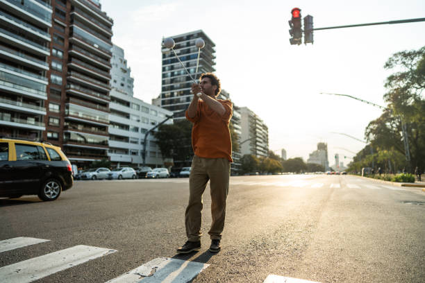 istock Juggler performing in city traffic 1877782025