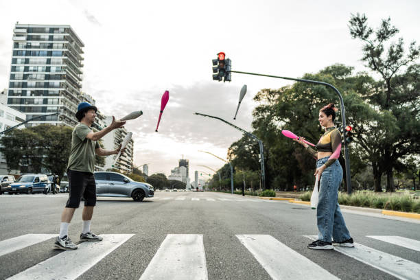 istock Jugglers performing in city traffic 1877782040