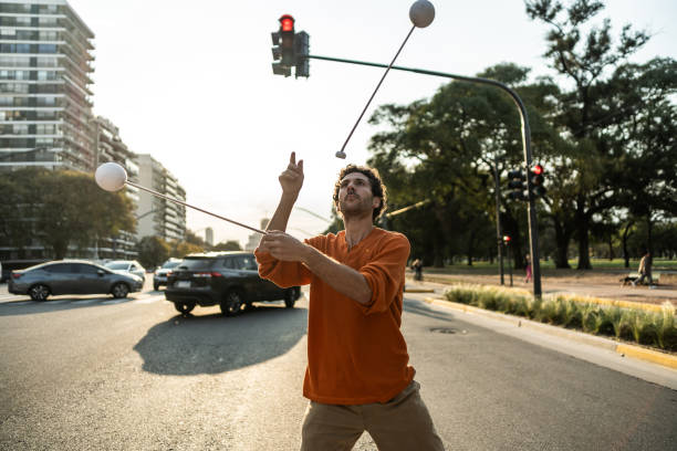 istock Juggler performing in city traffic 1877782052