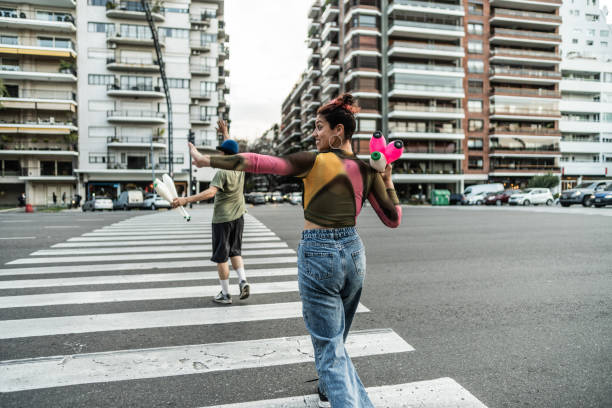 istock Jugglers performing in city traffic 1877782381