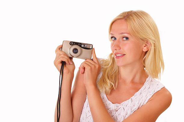 istock Pretty young woman with an old camera 187782071